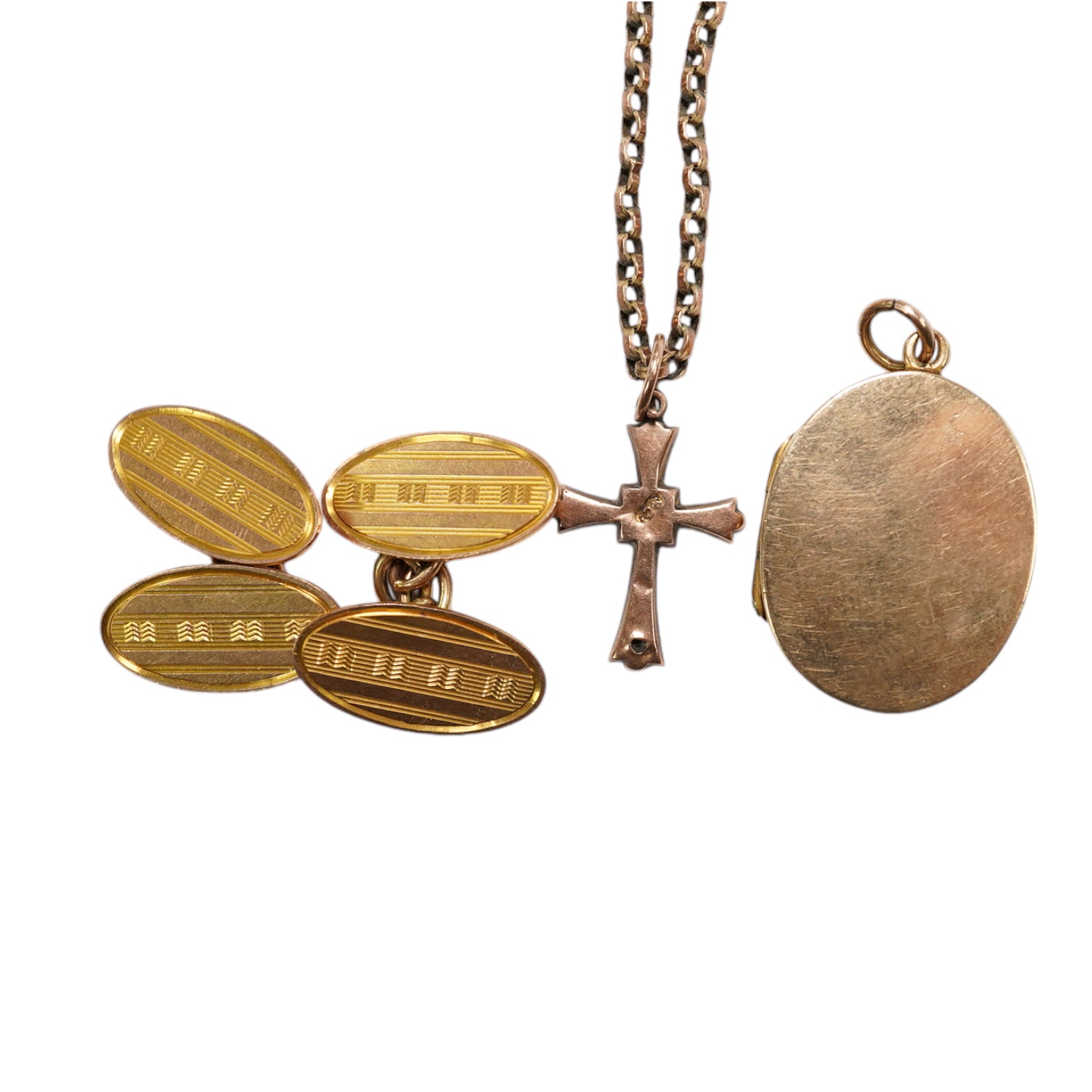 A pair of 9ct gold oval cufflinks, a 9ct chain with 9ct cross pendant and a 9ct gold oval locket, gross weight 14.3 grams. Condition - poor to fair